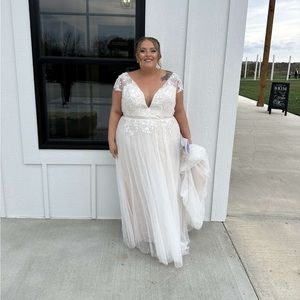 Wedding dress purchased from David’s Bridal. Size 20. I am 5’3 and wore flats.
